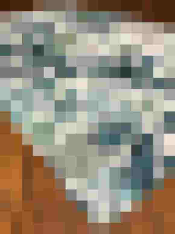 Stoff mit blattmotiv in grün und blau auf einem Holzuntergrund. Ideal für Schürzen.